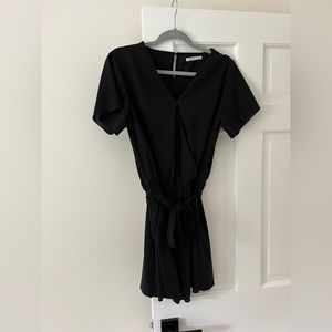 Large. Black Romper with tie around, hardly worn